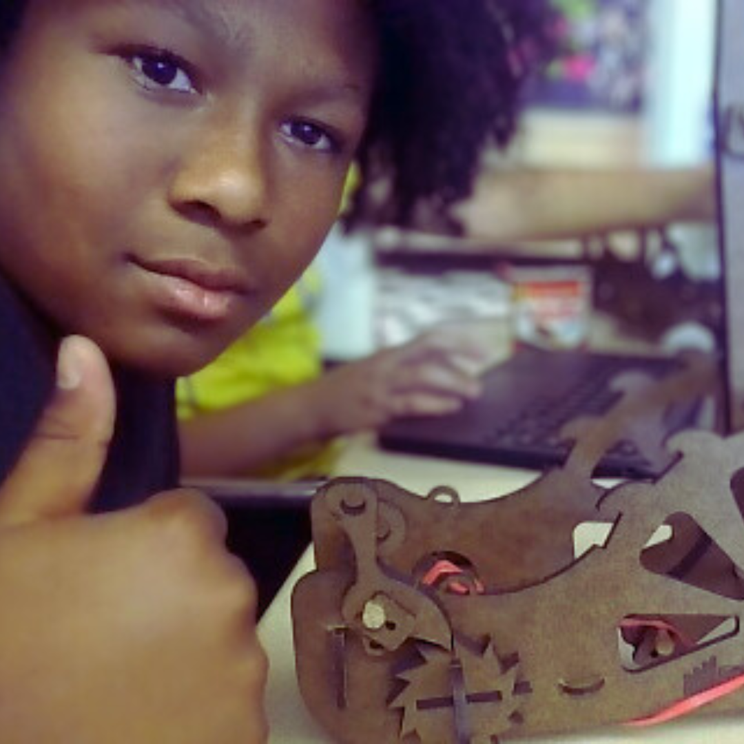 Kids build a catapult from a science kit to explore engineering and physics concepts.