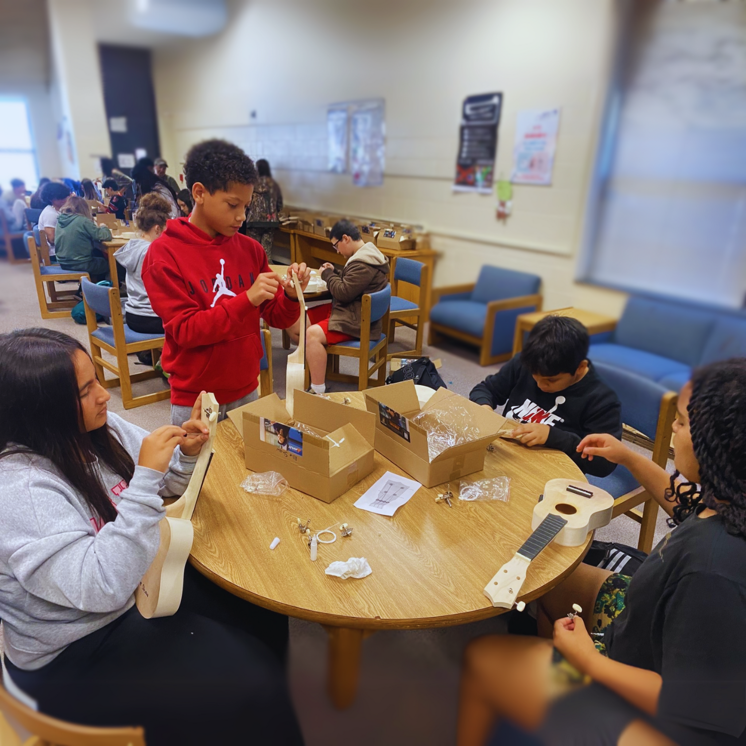 Middle school students engaging with Compass STEM curriculum activities that connect science and technology to real-world applications.