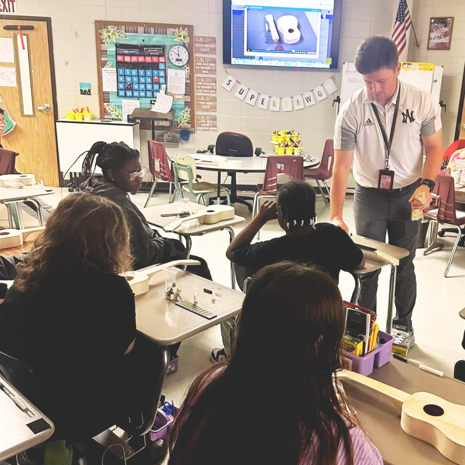 Middle school students engaging with Compass STEM curriculum activities that connect science and technology to real-world applications.
