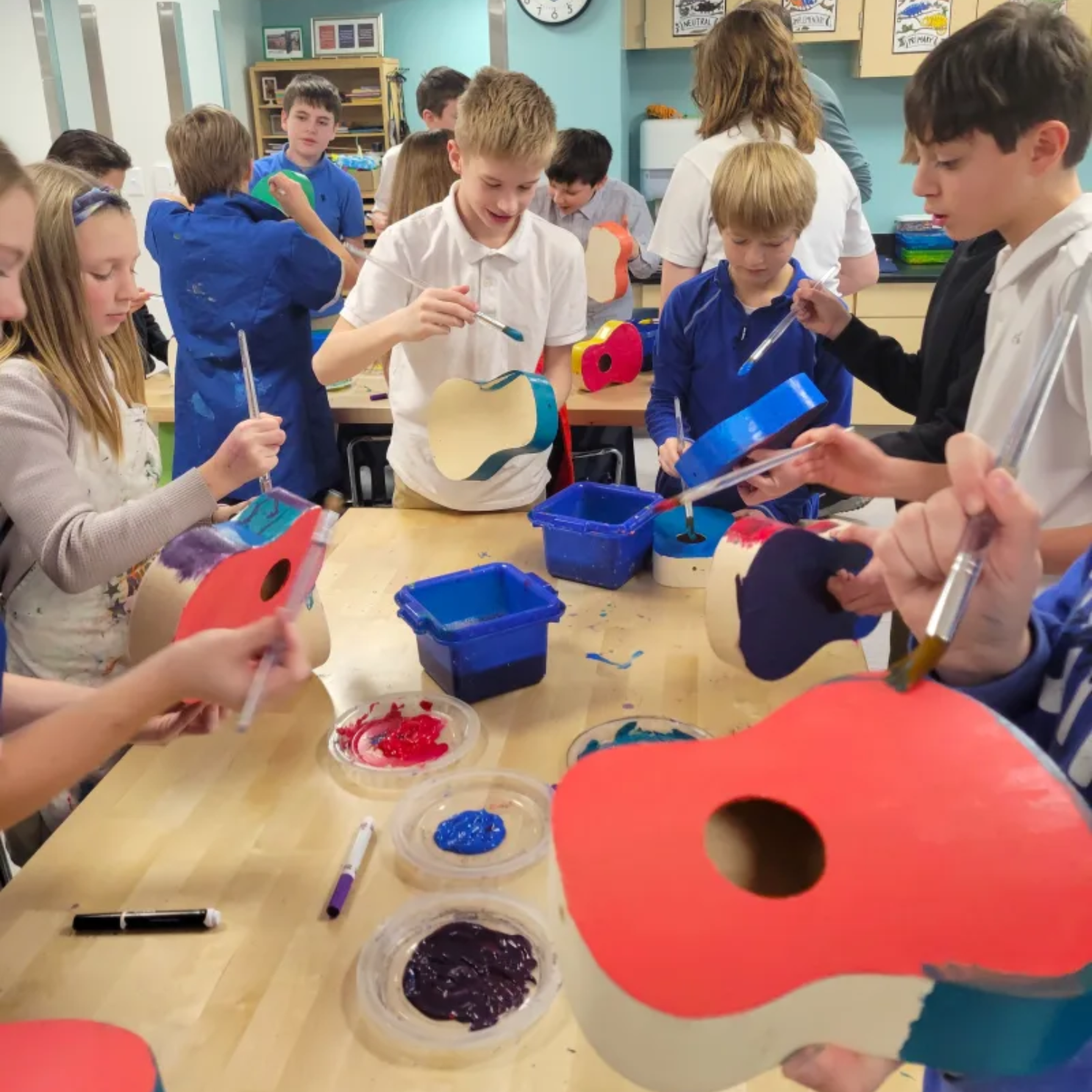 Middle school students engaging with Compass STEM curriculum activities that connect science and technology to real-world applications.
