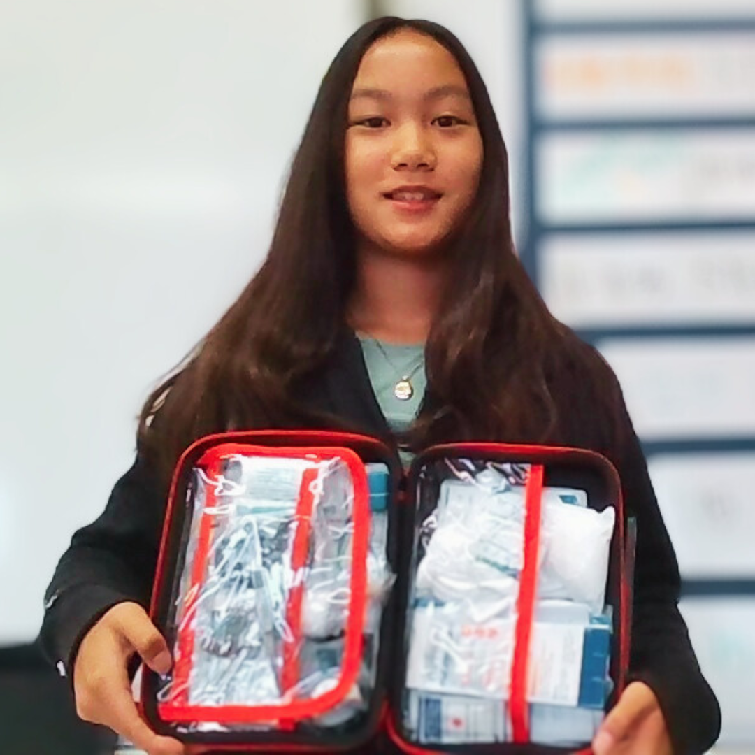 Kids practicing first aid techniques from a STEM project, using real medical supplies.