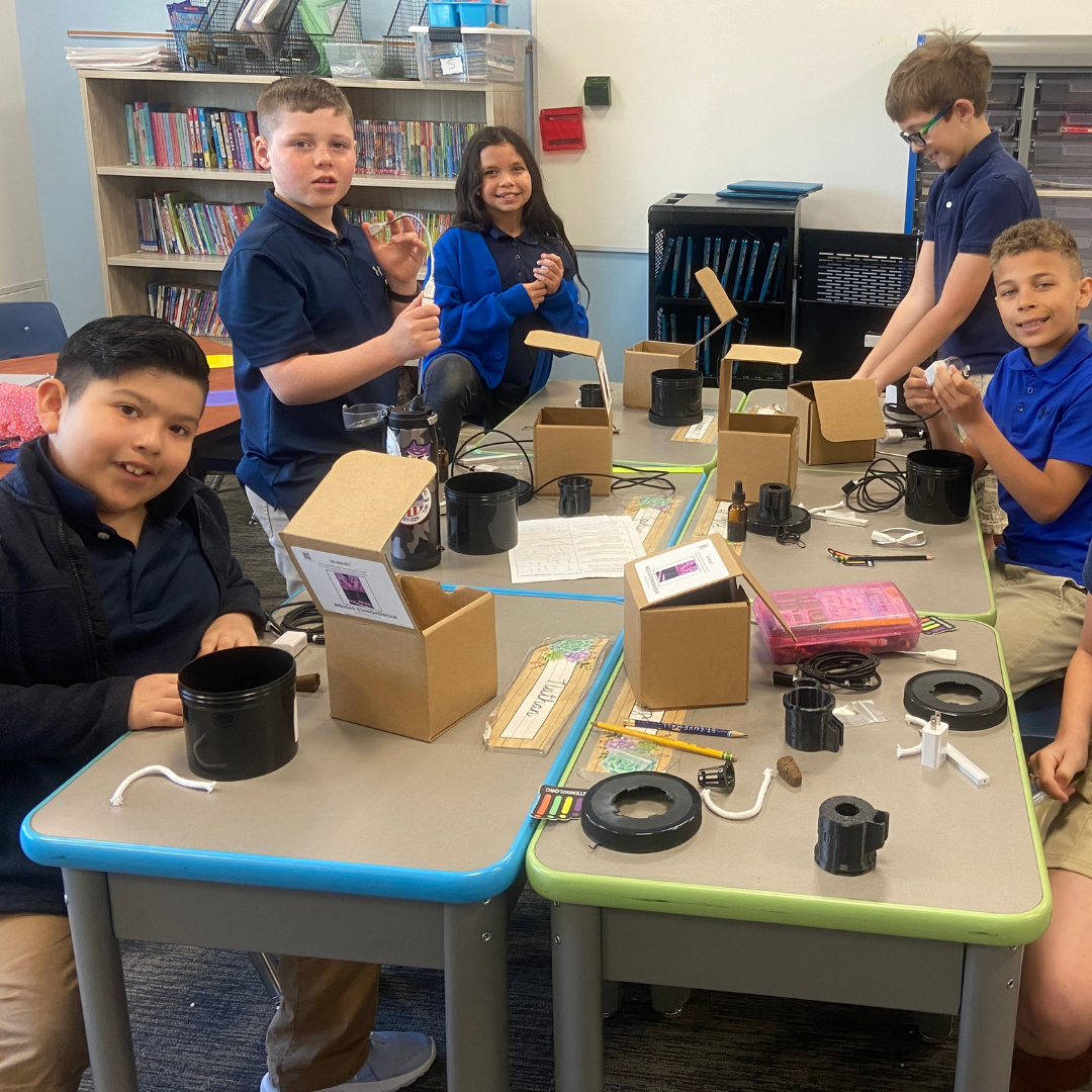 Kids build a hydroponic system from a science kit to grow butter lettuce sustainably.