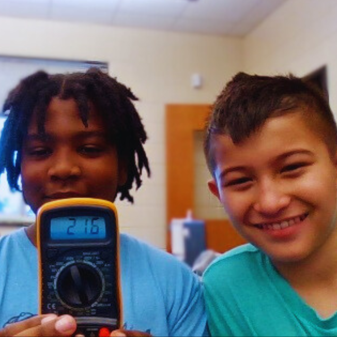 Kids use rulers, calipers, and multimeters from a science Measurement Kit to practice precision.