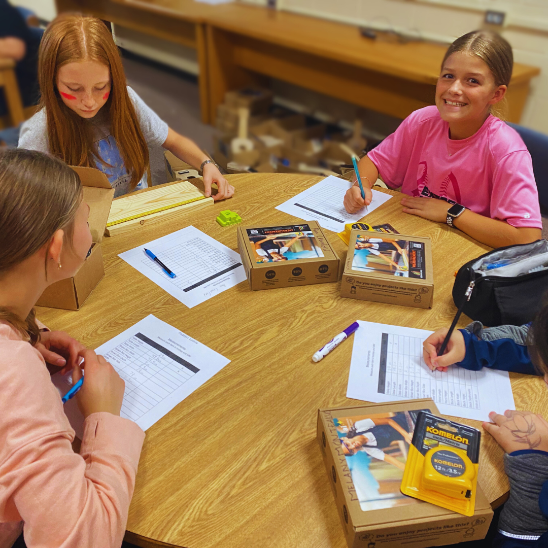 Kids use rulers, calipers, and multimeters from a STEM Measurement Kit to practice precision.