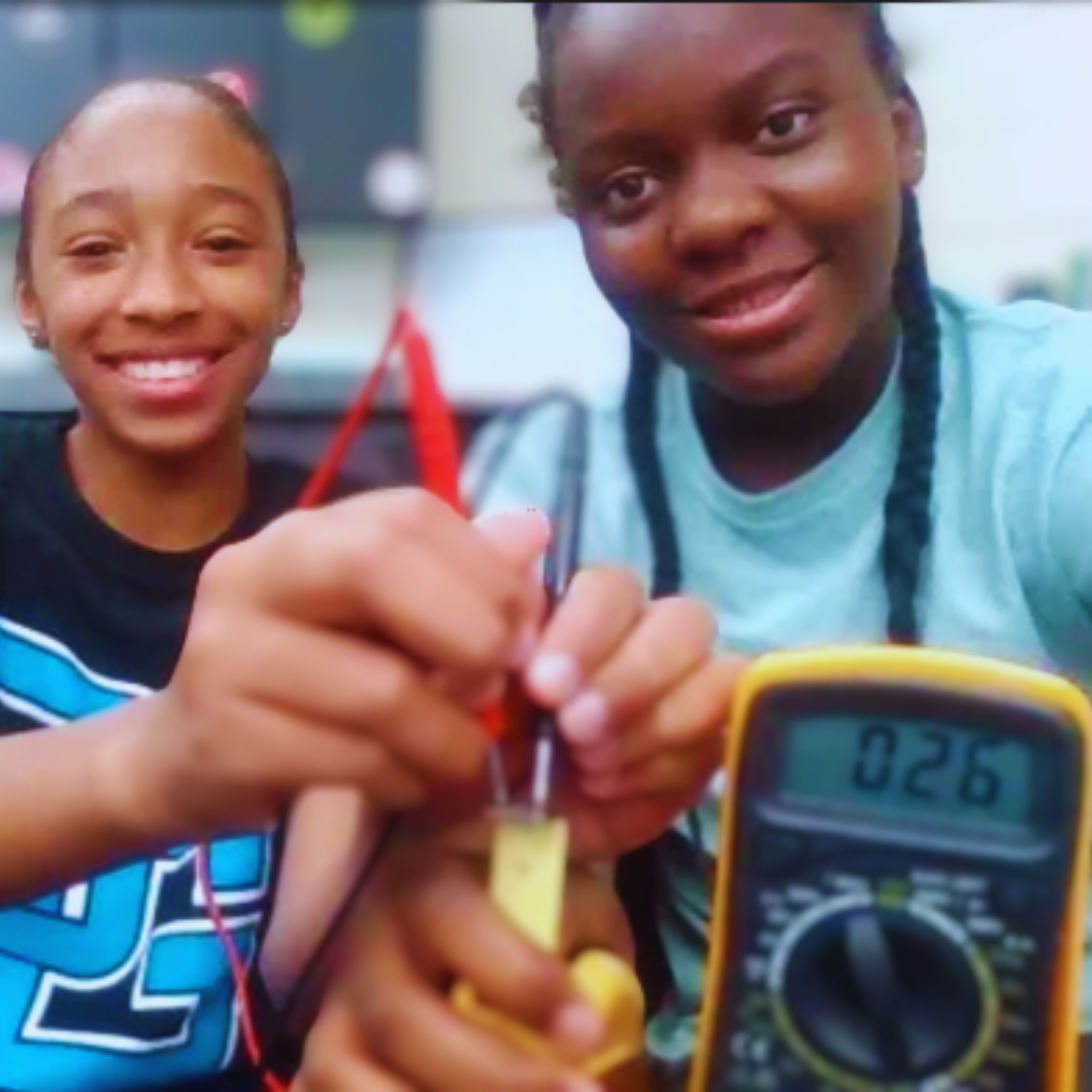 Kids use rulers, calipers, and multimeters from a Measurement STEM project to practice precision.