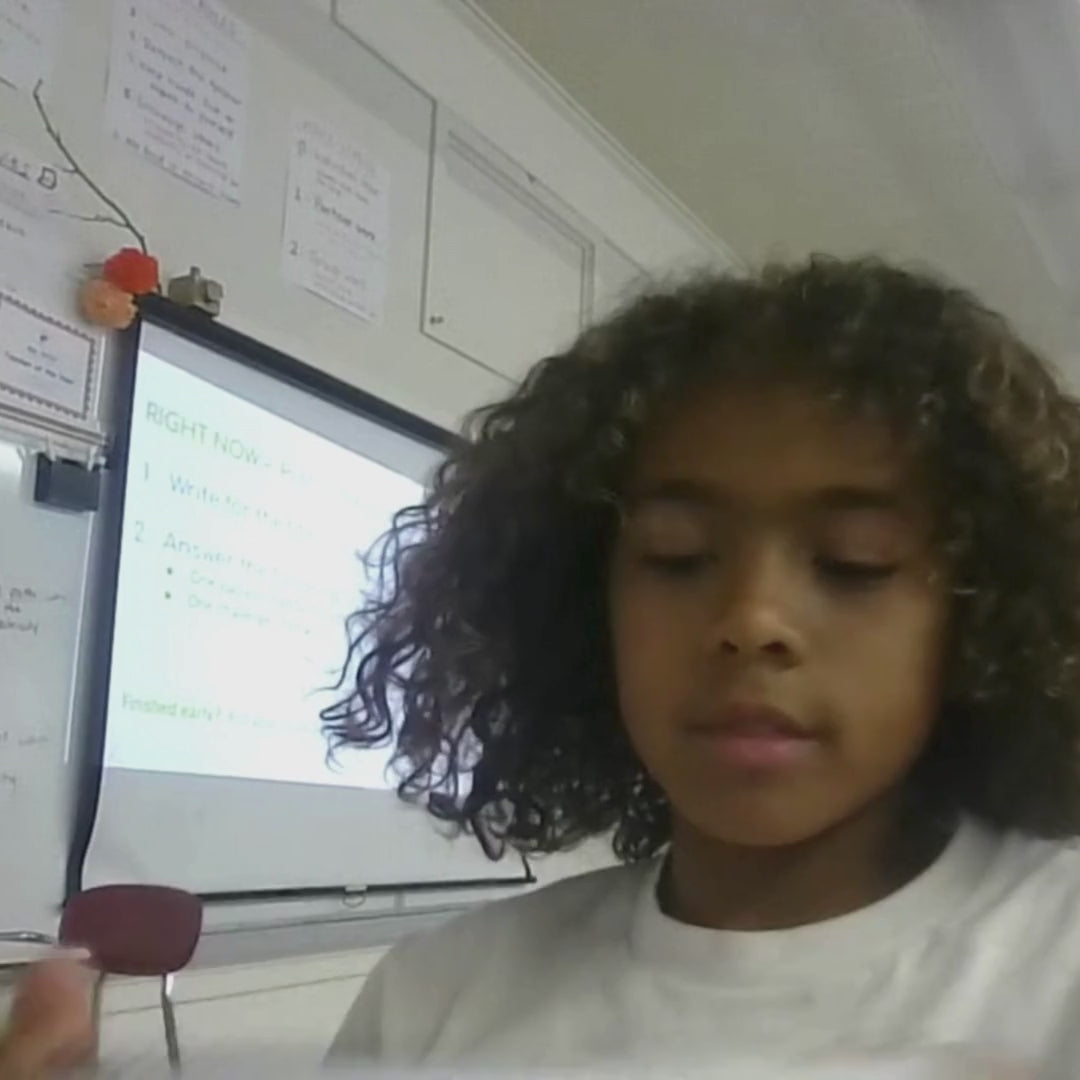 Kids build circuits with glowing Harley-Davidson models from a STEM project.