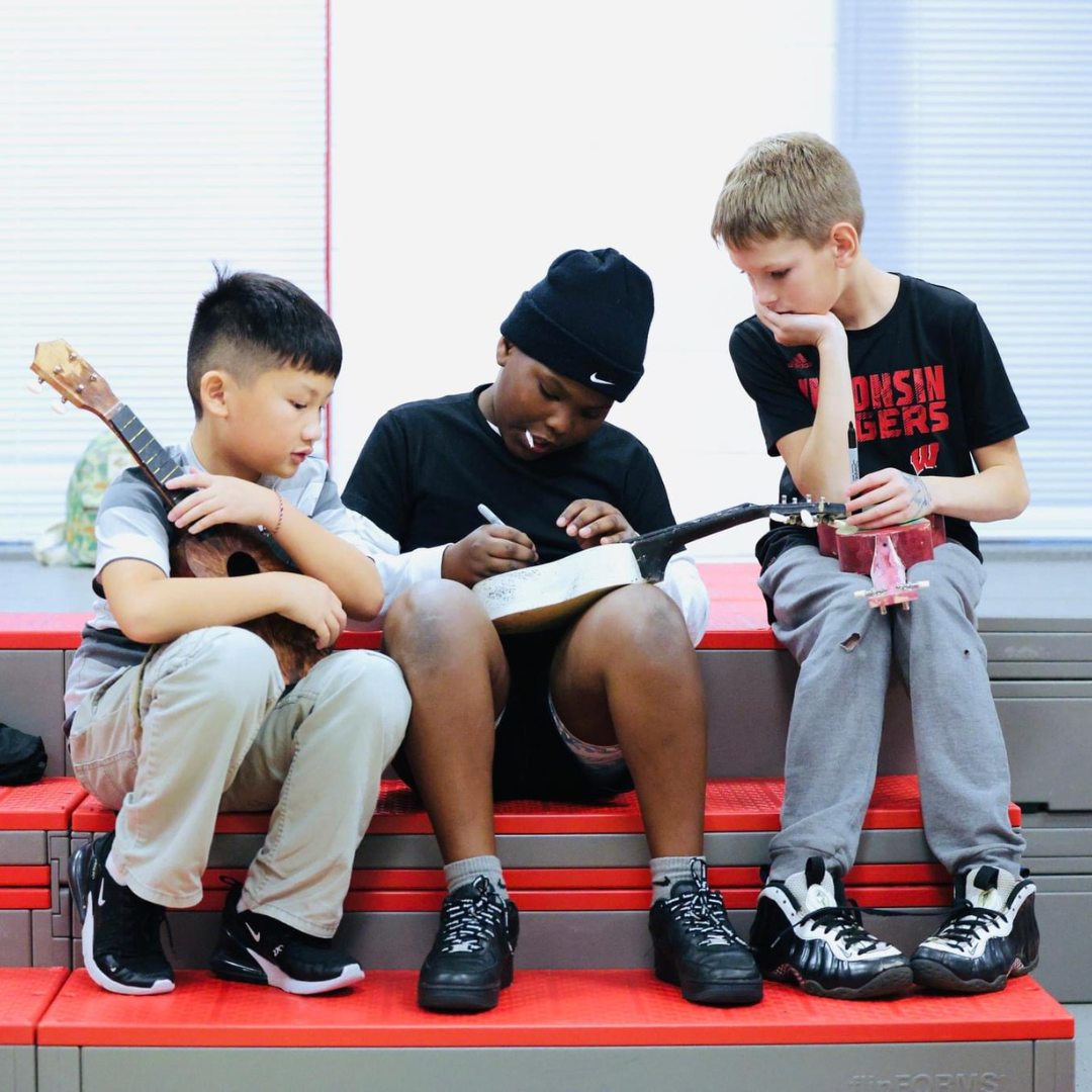 Kids assemble a ukulele from a STEM project to explore the science of sound and music.