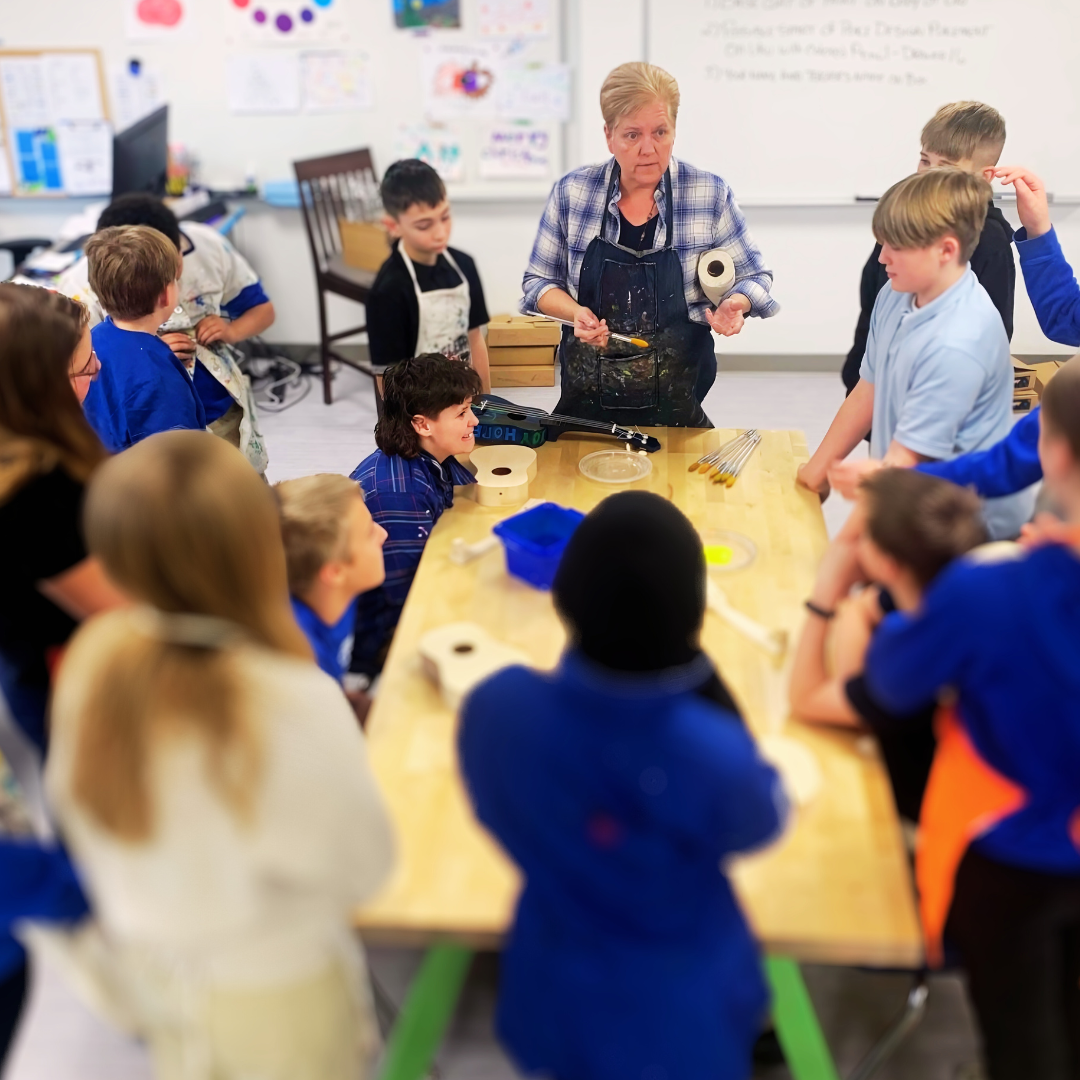 Kids assemble a ukulele from a STEM project to explore the science of sound and music.