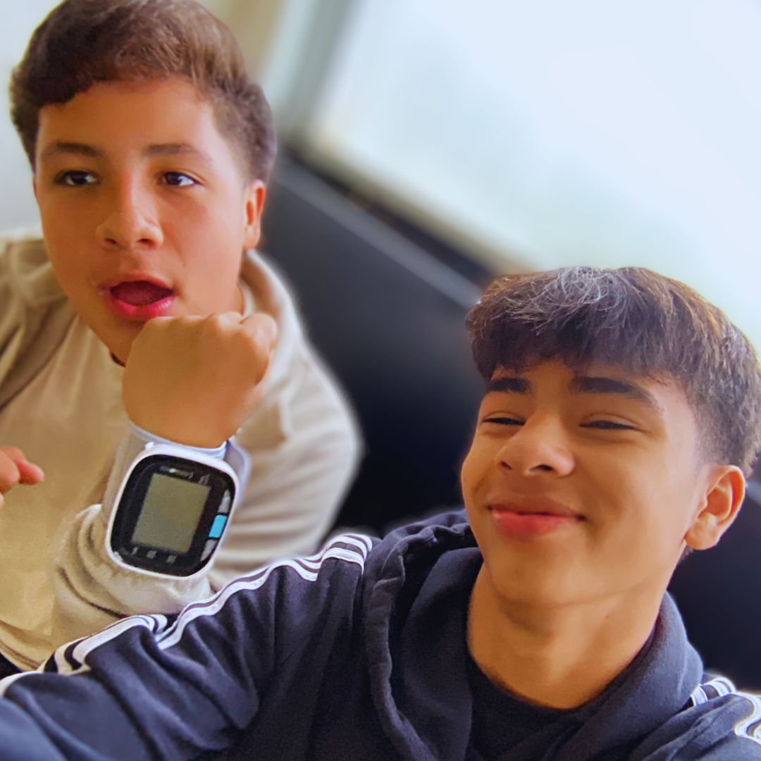 Kids use vital signs monitor from a STEM project to learn about healthcare applications.